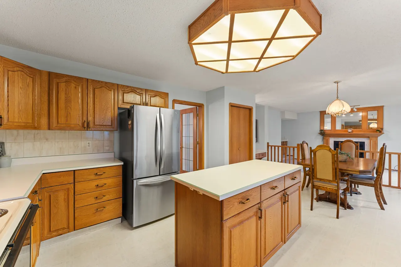 Kitchen with island and adjacent dining area