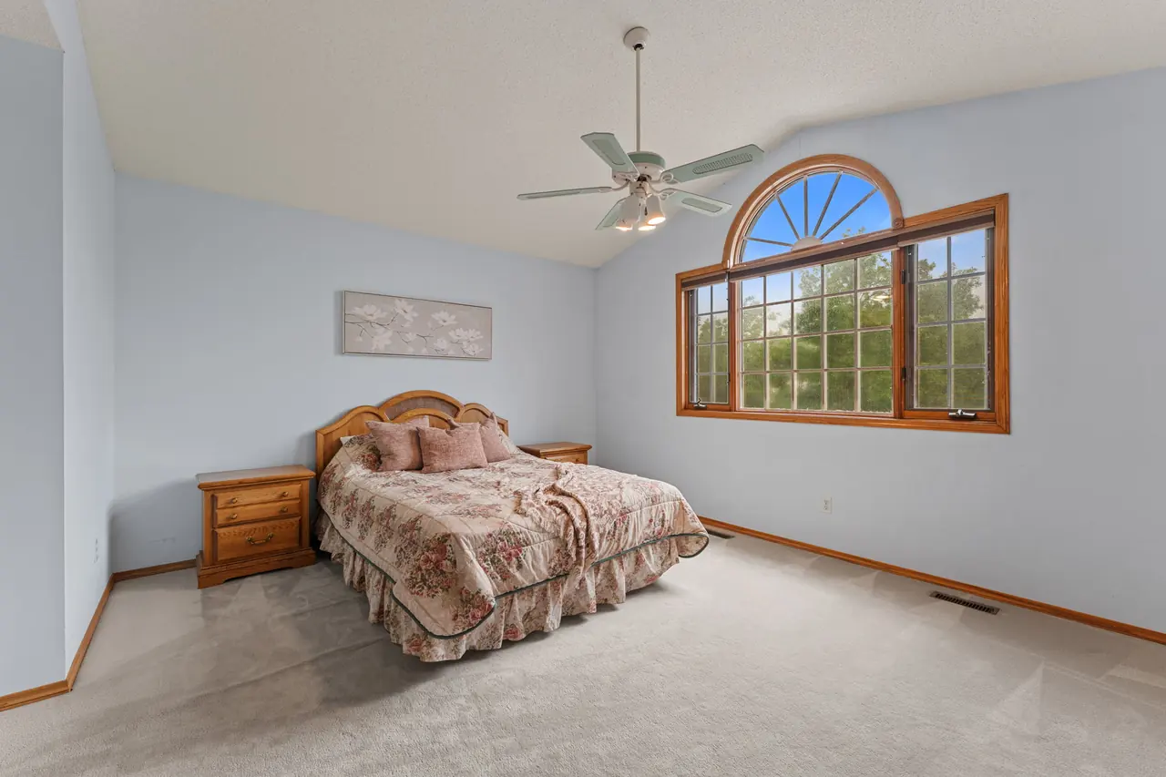 Primary bedroom with arched window